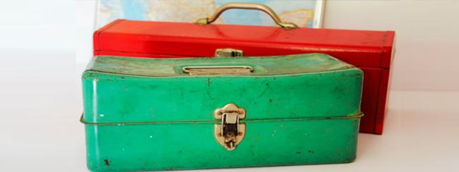 two colorful vintage toolboxes